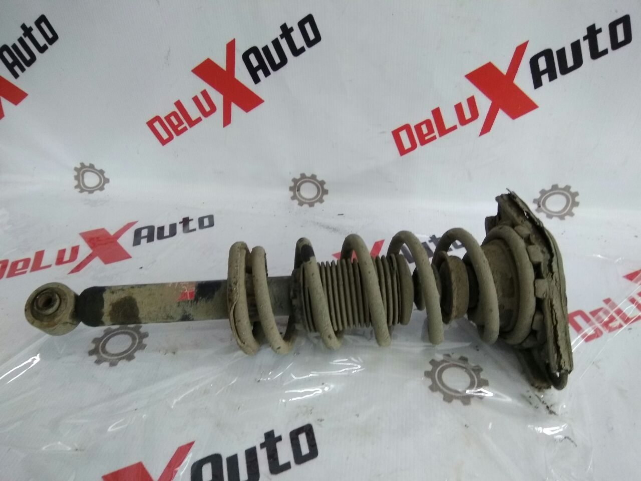 amortizor complet spate stânga pentru Nissan Almera 1.5 · 2005 hatchback